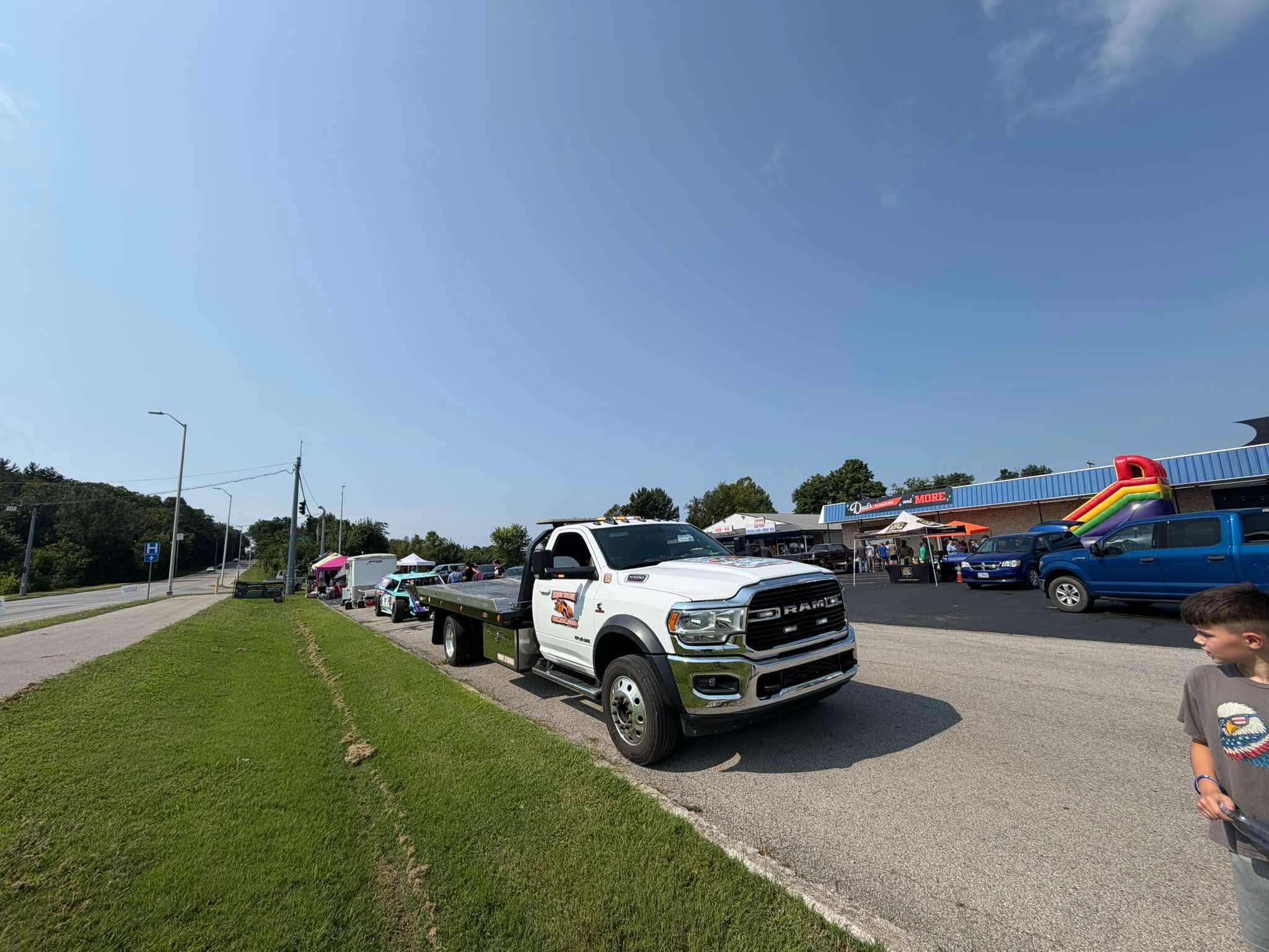 A community service truck parked outside The Twisted Willow during the sunny celebration